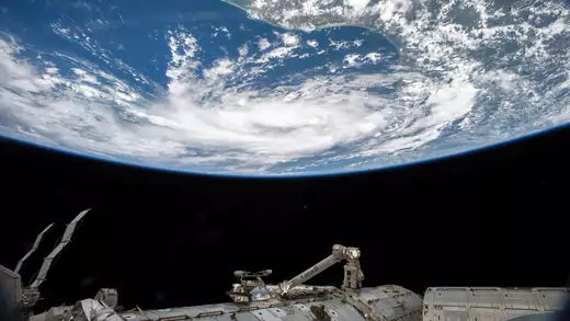 An astronaut aboard the International Space Station captures a photo of a tropical storm in the Gulf of Mexico. 