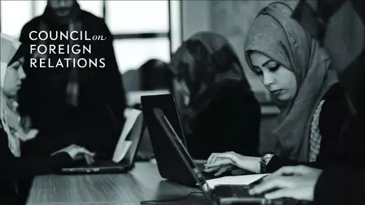 Women and the Law front cover image: Employees process data on their laptops at a data management services firm in Gaza.
