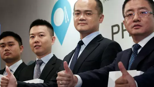 Chairman and CEO Wang Xing and executives of China's Meituan Dianping attend a news conference celebrating the company's IPO.