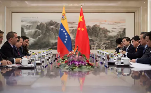 Venezuelan Foreign Minister Jorge Arreaza (2nd L) talks with China's Foreign Minister Wang Yi (2nd R) during a meeting at the Ministry of Foreign Affairs in Beijing on December 22, 2017.