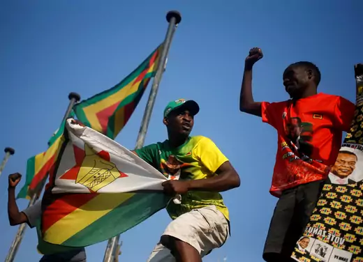 Supporters of President Emmerson Mnangagwa's ruling ZANU-PF party celebrate after the Constitutional Court confirmed Mnangagwa's disputed July 30 election victory in Harare, Zimbabwe August 24, 2018.
