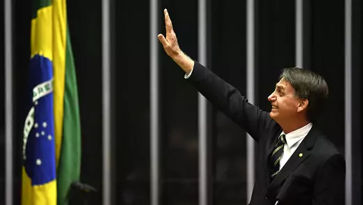 Bolsonaro waves to Brazilian flag