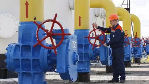 A Ukrainian worker checks gas valves of the main natural gas pipeline at the gas-compressor station in Boyarka village.