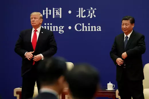 China's President Xi Jinping and U.S. President Donald Trump address business leaders at the Great Hall of the People in Beijing on November 9, 2017.