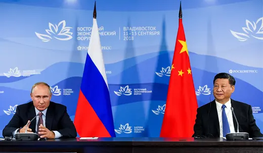 Russian President Vladimir Putin and Chinese President Xi Jinping attend a meeting with participants of a round table discussion on Russia-China Cooperation on the sidelines of the Eastern Economic Forum in Vladivostok, Russia September 11, 2018