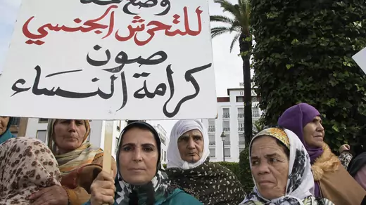 Women from various regions of Morocco protest against violence towards women, in Rabat. The placard reads, "Stopping harassment gives dignity for women." 