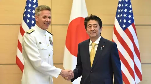 Admiral Philip S. Davidson (L), Commander of U.S. Indo-Pacific Command, shakes hands with Japan's Prime Minister Shinzo Abe at Abe's office in Tokyo, Japan June 21, 2018. Kazuhiro Nogi/Pool via Reuters