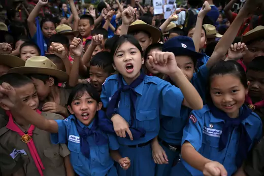 Students celebrate in front of Chiang Rai Prachanukroh Hospital after twelve soccer players and their coach were rescued from the Tham Luang cave complex in Thailand.