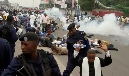 Policemen fire tear gas during protest in Kinshasa, Democratic Republic of Congo