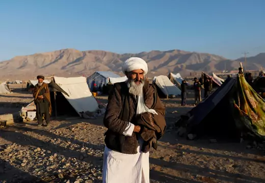 Internally displaced Afghan man walks around a camp in Herat.