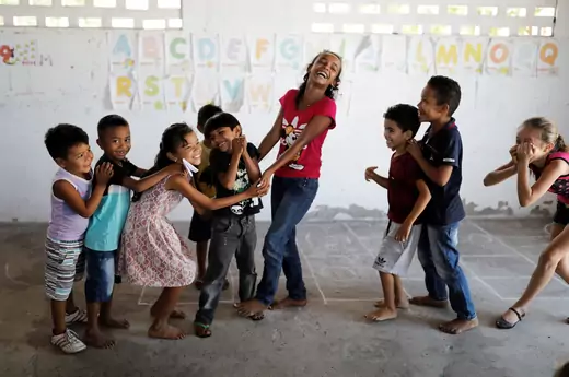 School children play in classroom at Sao Jose school in Morro Do Veridiano, Belagua