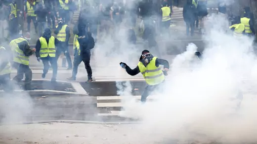 Protesters wearing yellow vests clash with police during a demonstration of the "yellow vests" movement in Nantes, France, December 22, 2018.