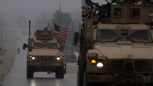 U.S. military vehicles drive through northern Syrian city of Manbij, December 30, 2018.