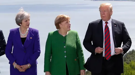Theresa May, Angela Merkel, and Donald J. Trump pose for a family photo at the G7 summit.
