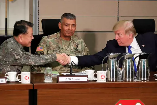 President Trump greets a South Korean general before a briefing from military commanders at Camp Humphreys in 2017.