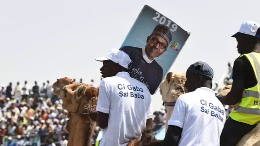 Supporters sit on camels during a campaign rally for President Muhammadu Buhari in Kano.
