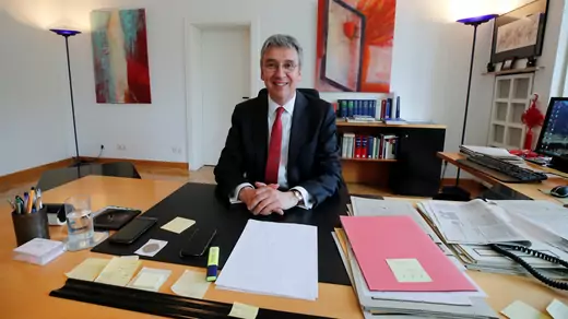 Andreas Mundt, president of Germany's Federal Cartel Office, is pictured at his desk before an interview with Reuters in Bonn, Germany April 17, 2018. Picture taken April 17, 2018. 
