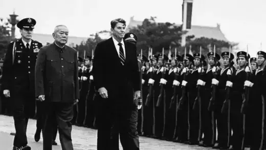 President Ronald Reagan and Chinese President Li Xiannian review the military honor guard in Beijing, April 26, 1984. 