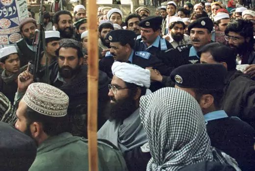Masood Azhar is surrounded by Pakistani police and his armed guards at Islamabad's Lal Mosque (Red Mosque) in Melody Market January 27, 2000.