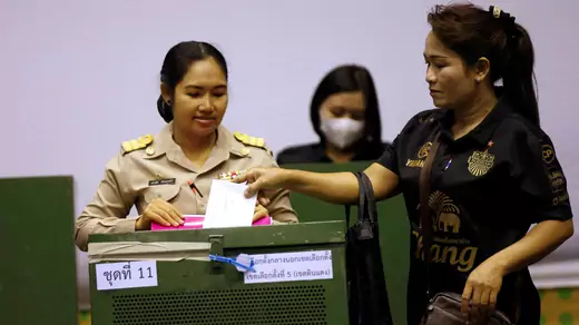 A woman casts her early vote in Bangkok.