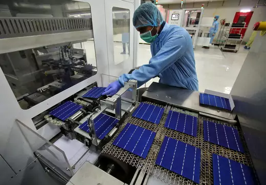 An employee works at a solar cell production line at Jupiter Solar Power Limited (JSPL) plant in Baddi, in the northern state of Himachal Pradesh, India May 29, 2017.