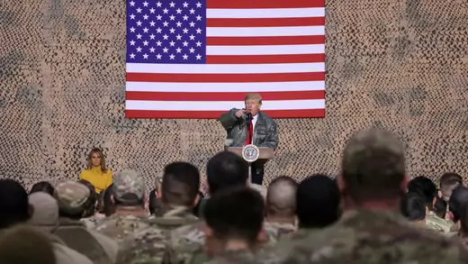 U.S. President Donald Trump, with first lady Melania Trump, delivers remarks to U.S. troops in an unannounced visit to Al Asad Air Base, Iraq, December 26, 2018.