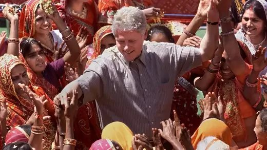 President Clinton reaches out to residents of Nayla, India.