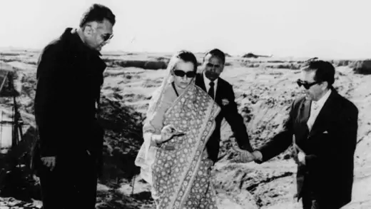 Indian Prime Minister Indira Gandhi examines the nuclear test site.