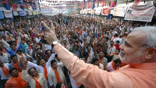 Prime Minister Narendra Modi waves to supporters. 