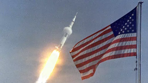 The American flag heralds the launch of Apollo 11, the first lunar landing mission, on July 16, 1969.