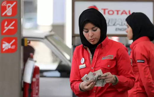 A female employee works at a petrol station in Cairo, Egypt. February 24, 2016. 