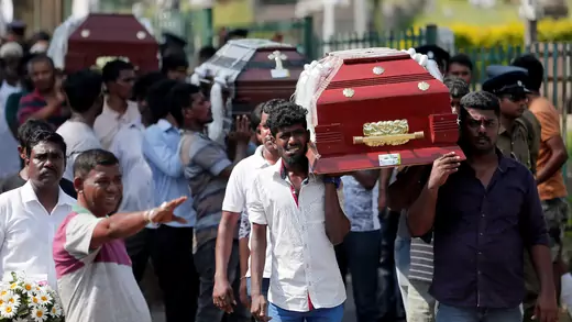 Coffins of victims are carried in Colombo, Sri Lanka.
