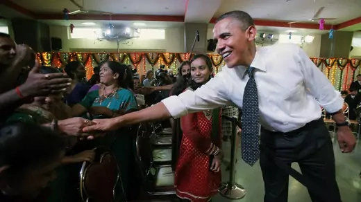 U.S. president Barack Obama greets students in Mumbai.