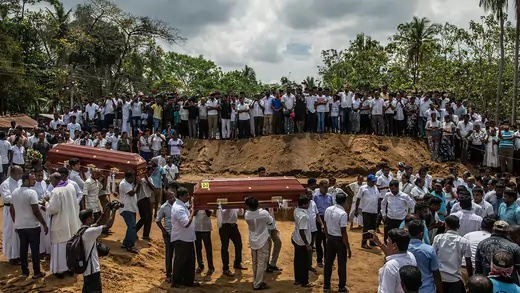 Mourners carry the coffins of victims of the Sri Lanka bombings during a mass funeral in April. 