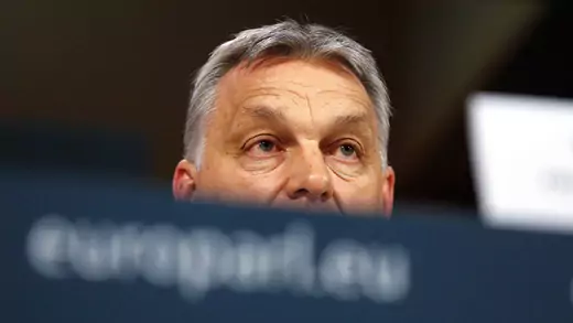 Viktor Orban attends a news conference.