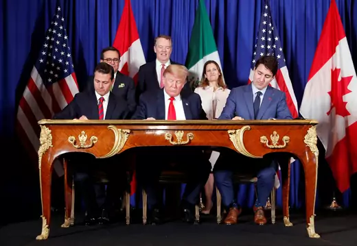 U.S. President Donald J. Trump, Canadian Prime Minister Justin Trudeau, and former Mexican President Enrique Pena Nieto sign the United States-Mexico-Canada Agreement.