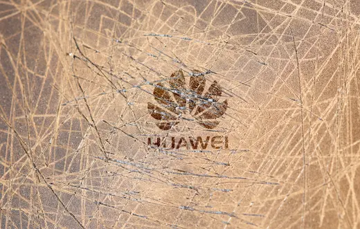 A scratched surface Huawei logo is seen on a smarthphone in this illustration picture 