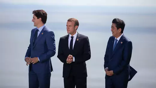 Canadian Prime Minister Justin Trudeau, French President Emmanuel Macron, and Japanese Prime Minister Shinzo Abe pose for a photo during the Group of Seven Summit, in Canada, on June 8, 2018.