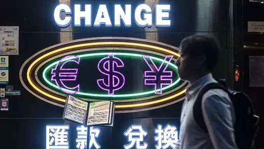 A man passes by a currency exchange shop in Hong Kong, on May 29, 2019.