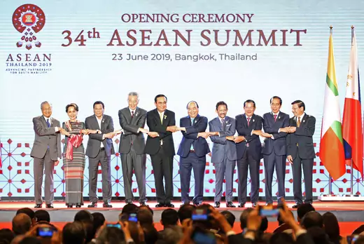 ASEAN leaders shake hands on stage during the opening ceremony of the 34th ASEAN Summit at the Athenee Hotel in Bangkok, Thailand June 23, 2019