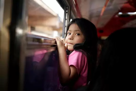 Salvadoran migrant child, Lupe, sits on a bus as she leaves the premises of the National Migration Institute (INM) after being deported from the United States, June 22, 2019.