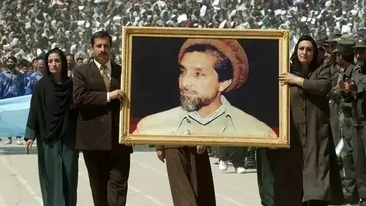 Afghans carry a picture of Massood in Kabul.