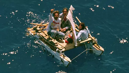Three Cuban refugees sit on a makeshift raft in the Florida straits.