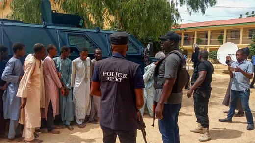 Police officers outline suspected Boko Haram militants in Maiduguri, northeast Nigeria, on July 18, 2018.