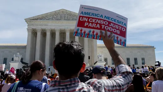 Protesters gather outside a Supreme Court hearing on the 2020 census.