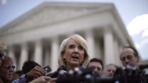 Arizona Governor Jan Brewer addresses the press outside the U.S. Supreme Court following oral arguments over SB1070. 
