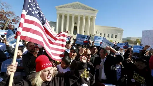 Immigrants and community leaders rally in front of the U.S. Supreme Court.