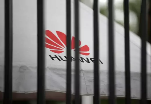 A Huawei logo is seen outside the fence at its headquarters in Shenzhen. Jason Lee/Reuters