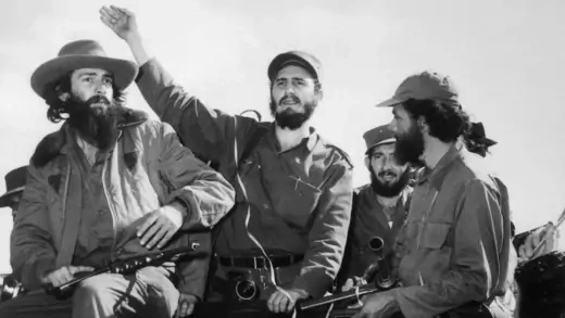  Fidel Castro waves to a cheering crowd.