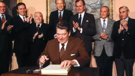 President Ronald Reagan signs the Immigration Reform and Control Act. 
